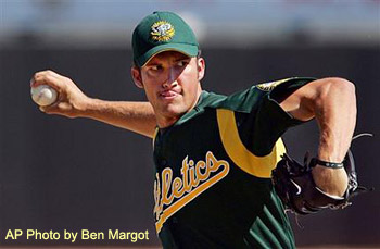 [Photo of Huston pitching 
in A's uniform]