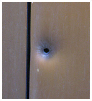 [Bullet hole]